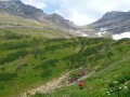 Backpacker standing in a mountain valley