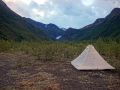 Tent pitched on the river bank
